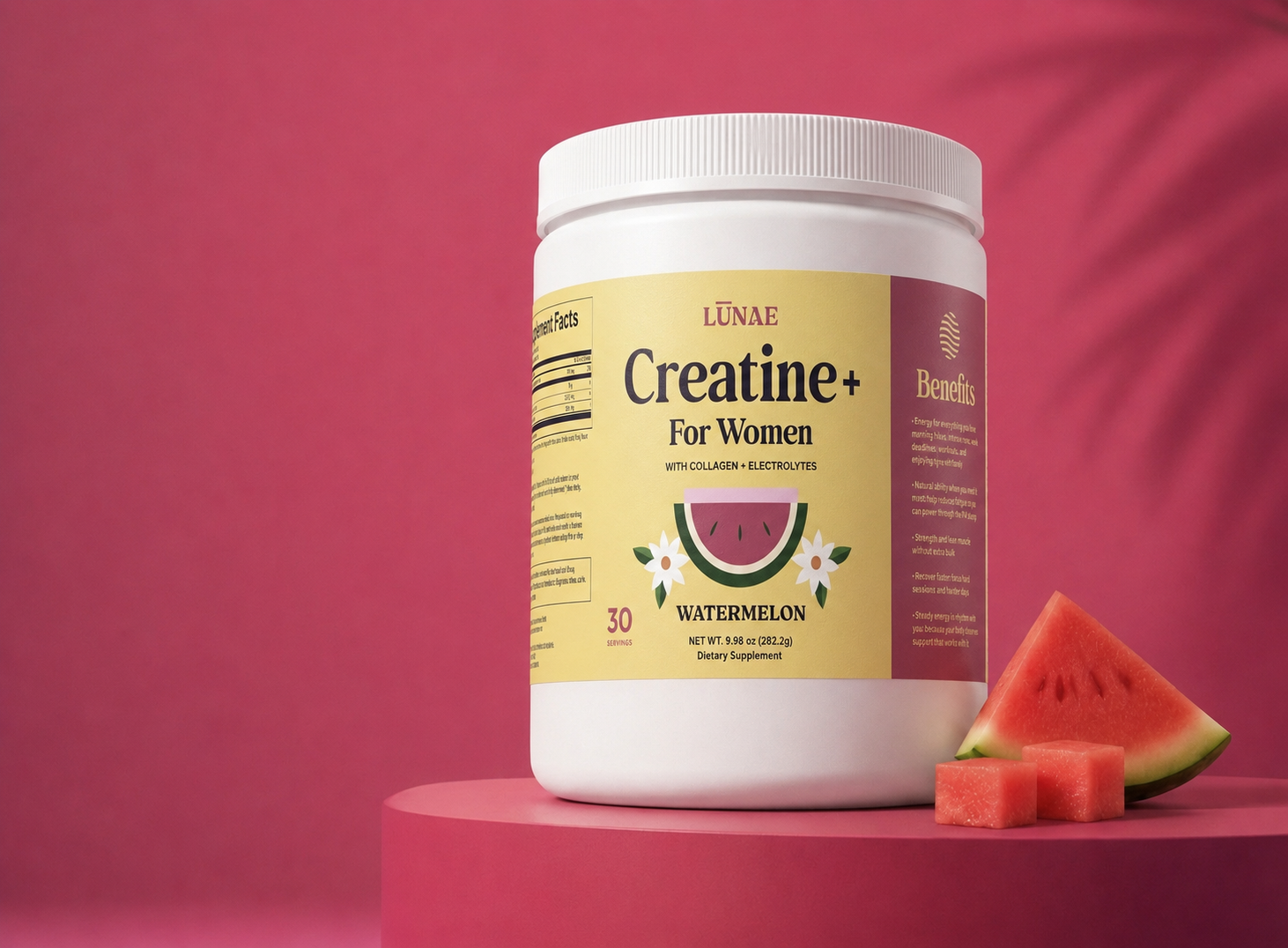 LŪNAE Creatine+ jar on a watermelon pedestal beside fresh watermelon